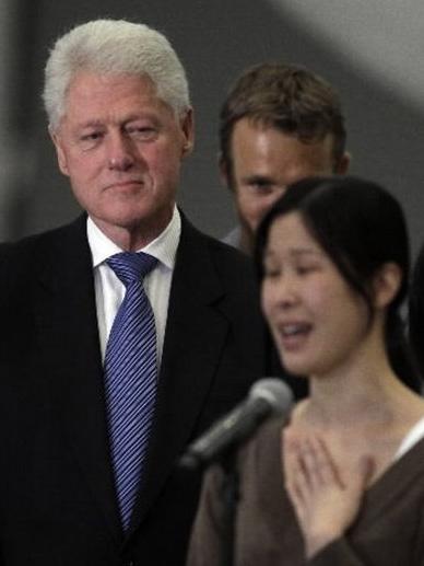 Clinton and Laura Ling